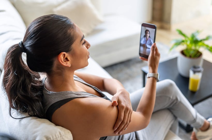Woman doing a telehealth doctor visit on phone